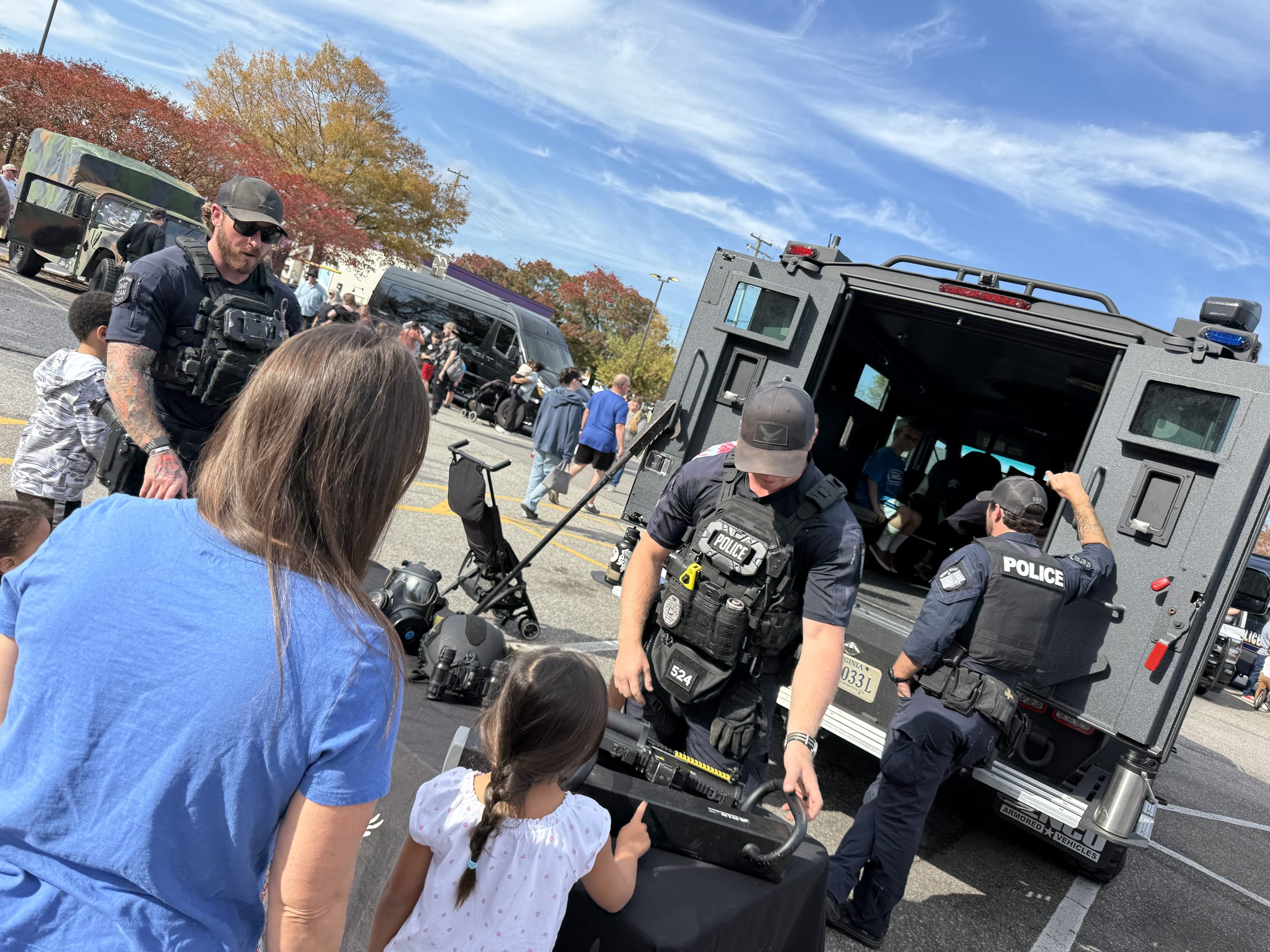 cops swat vehicle showing kids and parents the tools